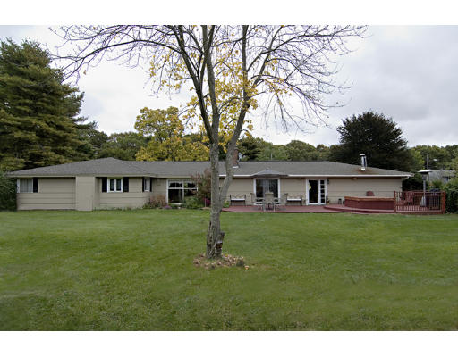 73 Joseph Road Framingham, MA 01701 - Photo 12 of 19 a view of a big house with a big yard and large trees