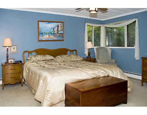 73 Joseph Road Framingham, MA 01701 - Photo 8 of 19 a bed sitting in a bedroom next to a window