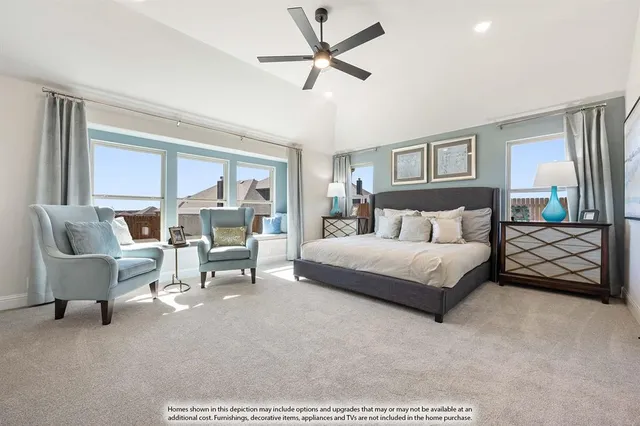 a bedroom with a bed a couch and a chandelier