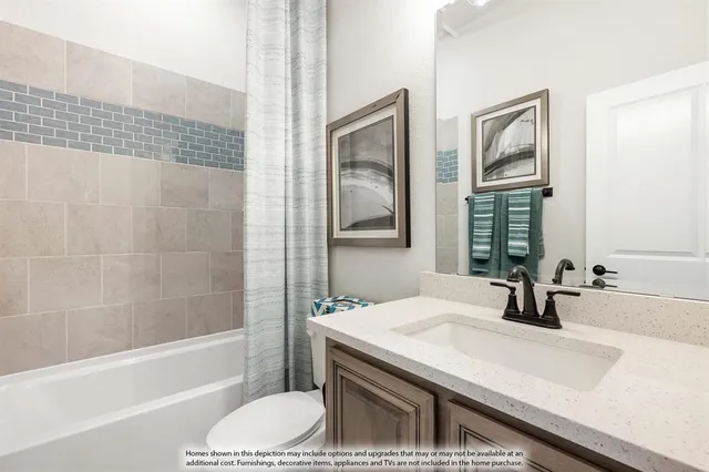 a bathroom with a granite countertop sink a toilet a mirror and shower