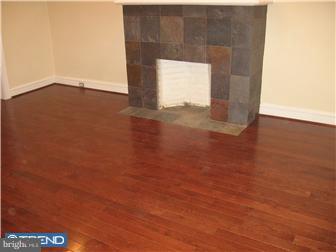 271 Copley Road Upper Darby, PA 19082 - Photo 12 of 12 an empty room with wooden floor and windows