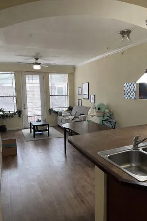 a living room with furniture and a large window