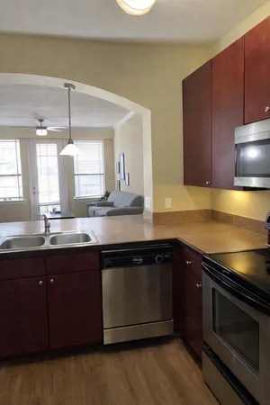 a kitchen with a sink and a stove
