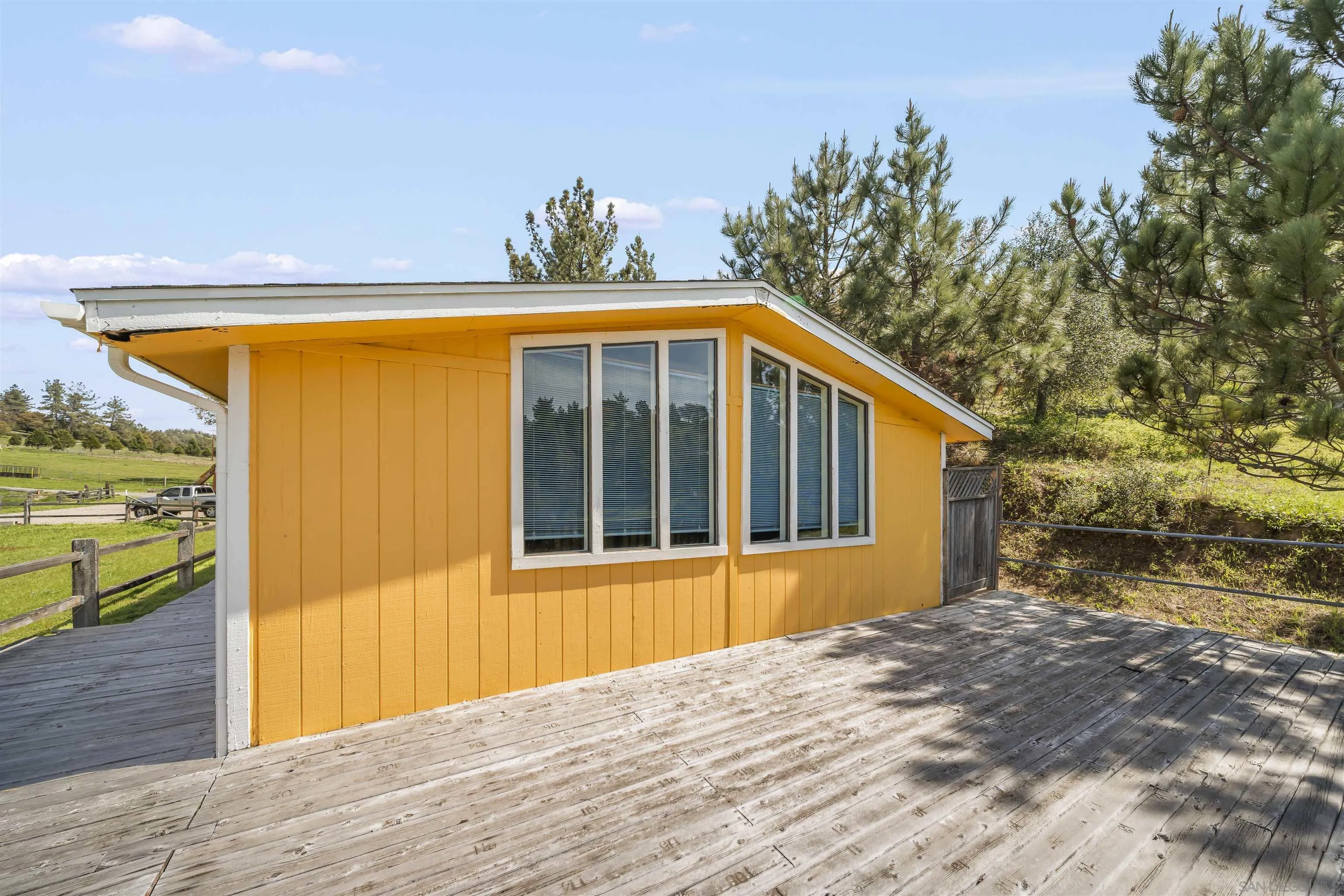 2464 Wynola Road Julian, CA 92036 - Photo 23 of 50 a front view of a house with a yard