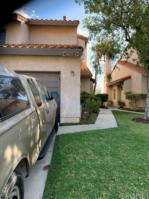 a view of a house with a back yard