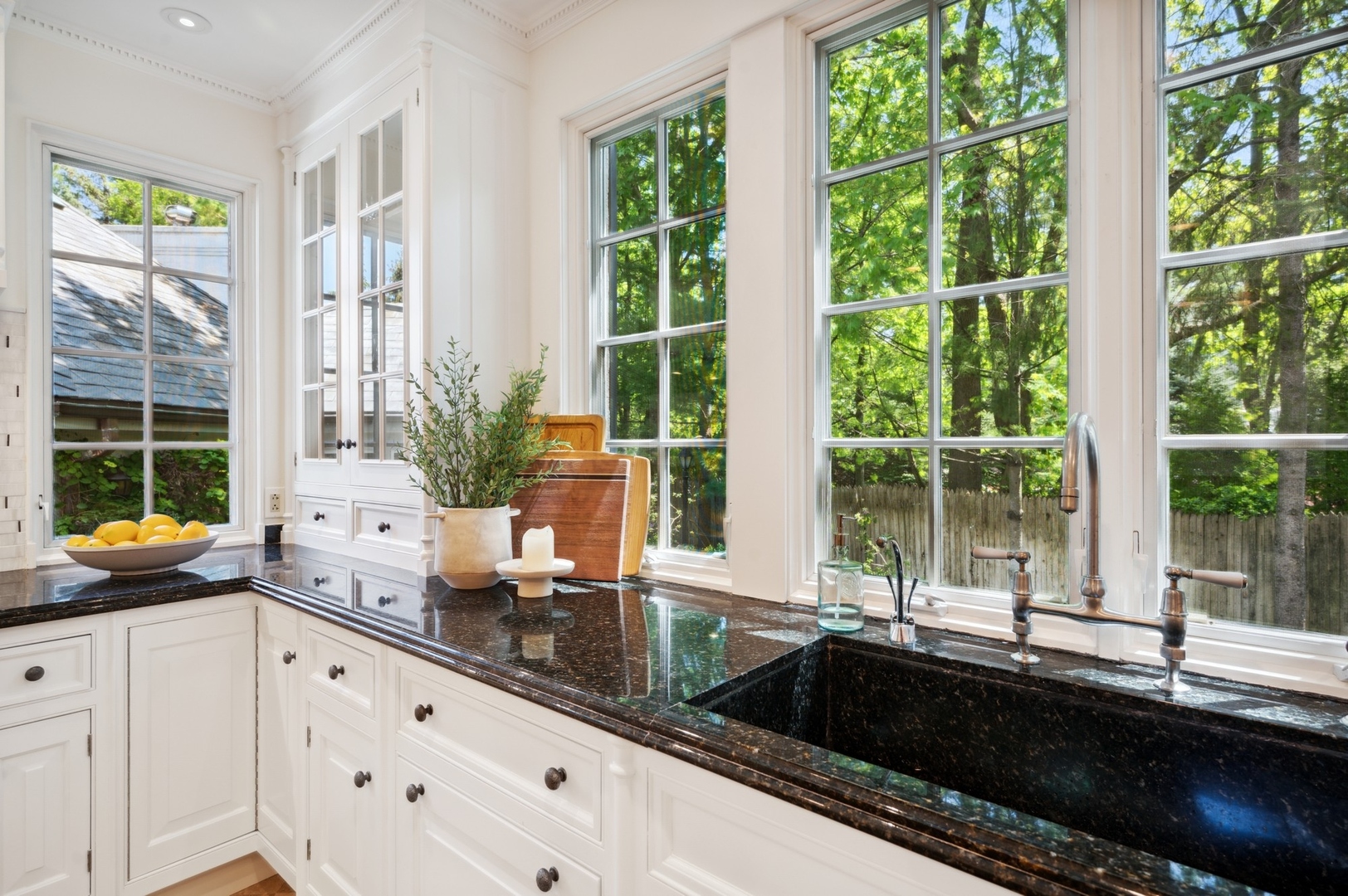1140 Seneca Road Wilmette, IL 60091 - Photo 16 of 65 a kitchen with granite countertop a large window and white appliances