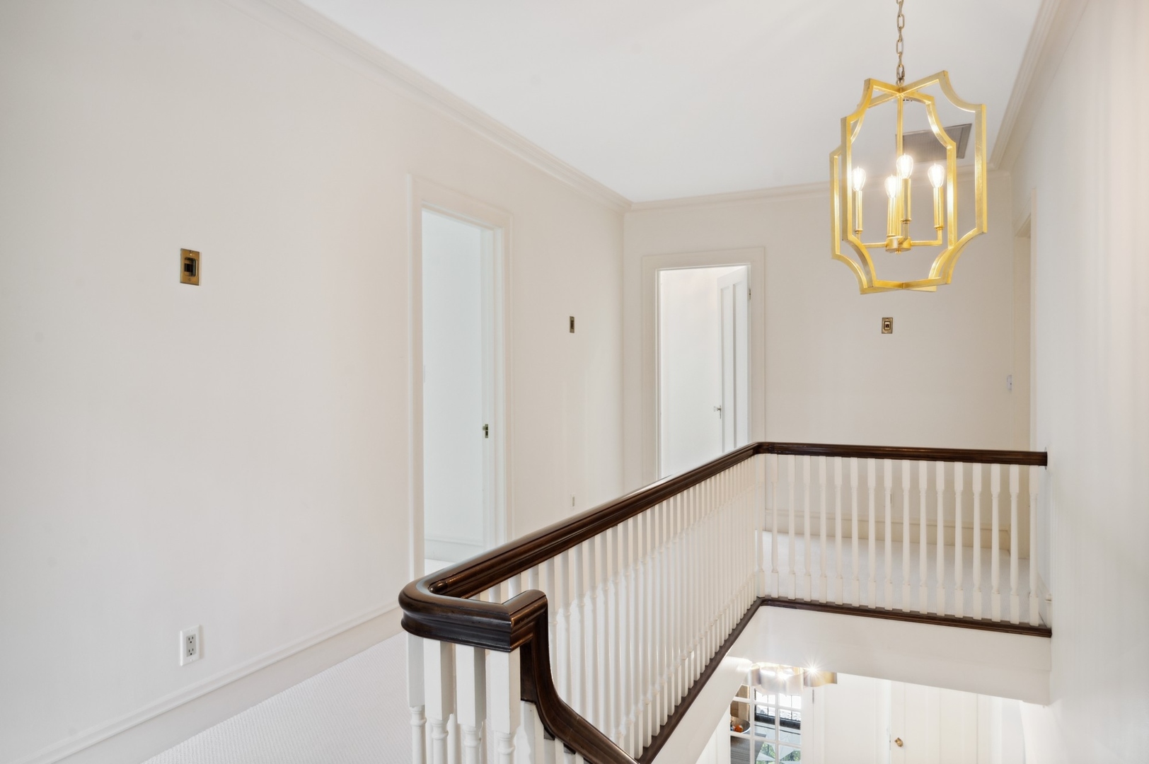 1140 Seneca Road Wilmette, IL 60091 - Photo 27 of 65 a view of staircase with railing and a chandelier