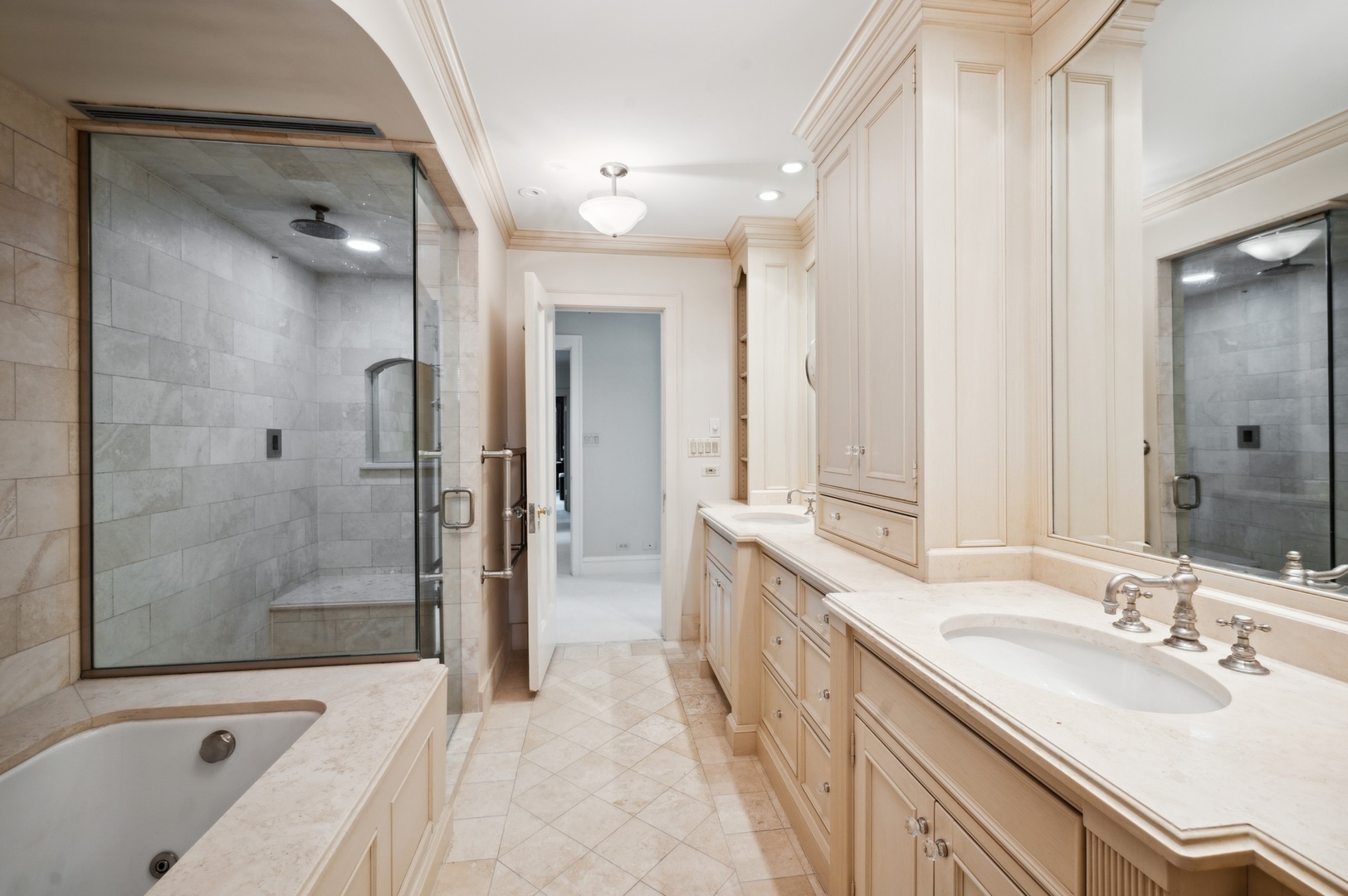 1140 Seneca Road Wilmette, IL 60091 - Photo 32 of 65 a bathroom with a bathtub shower sink vanity and a mirror