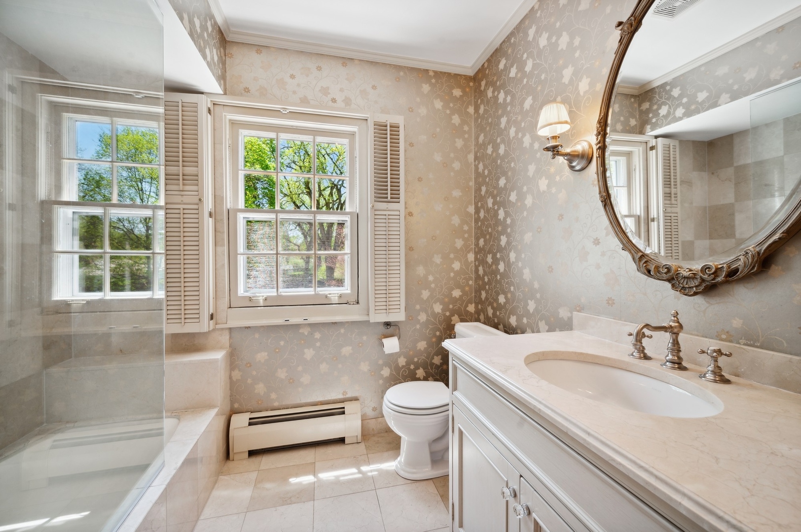 1140 Seneca Road Wilmette, IL 60091 - Photo 35 of 65 a bathroom with a sink a toilet and a mirror