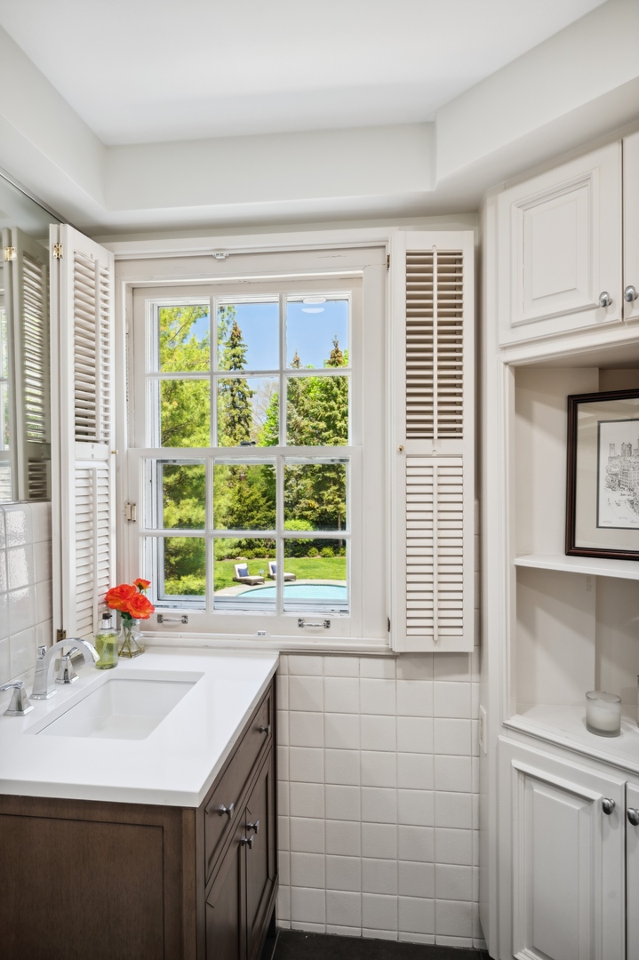 1140 Seneca Road Wilmette, IL 60091 - Photo 38 of 65 a kitchen with a sink and large window