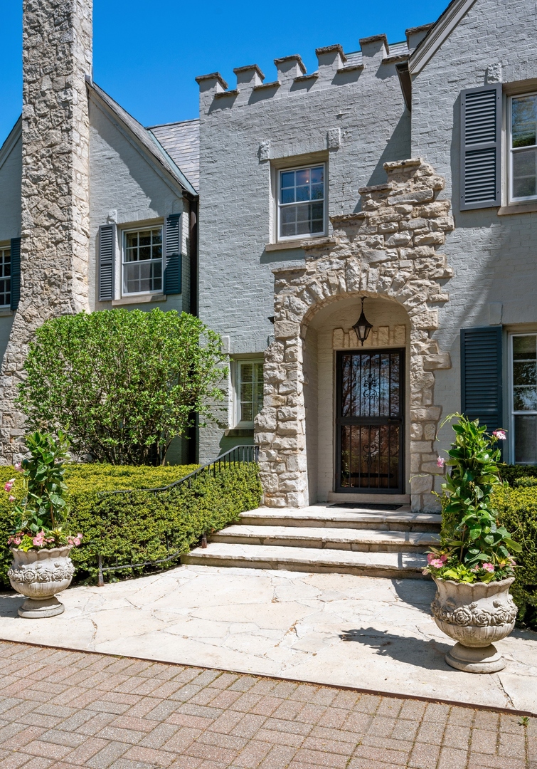1140 Seneca Road Wilmette, IL 60091 - Photo 4 of 65 a front view of a house with a yard