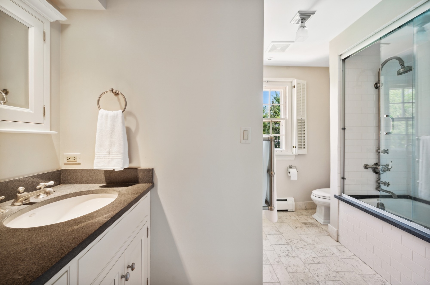 1140 Seneca Road Wilmette, IL 60091 - Photo 42 of 65 a bathroom with a granite countertop sink and a mirror