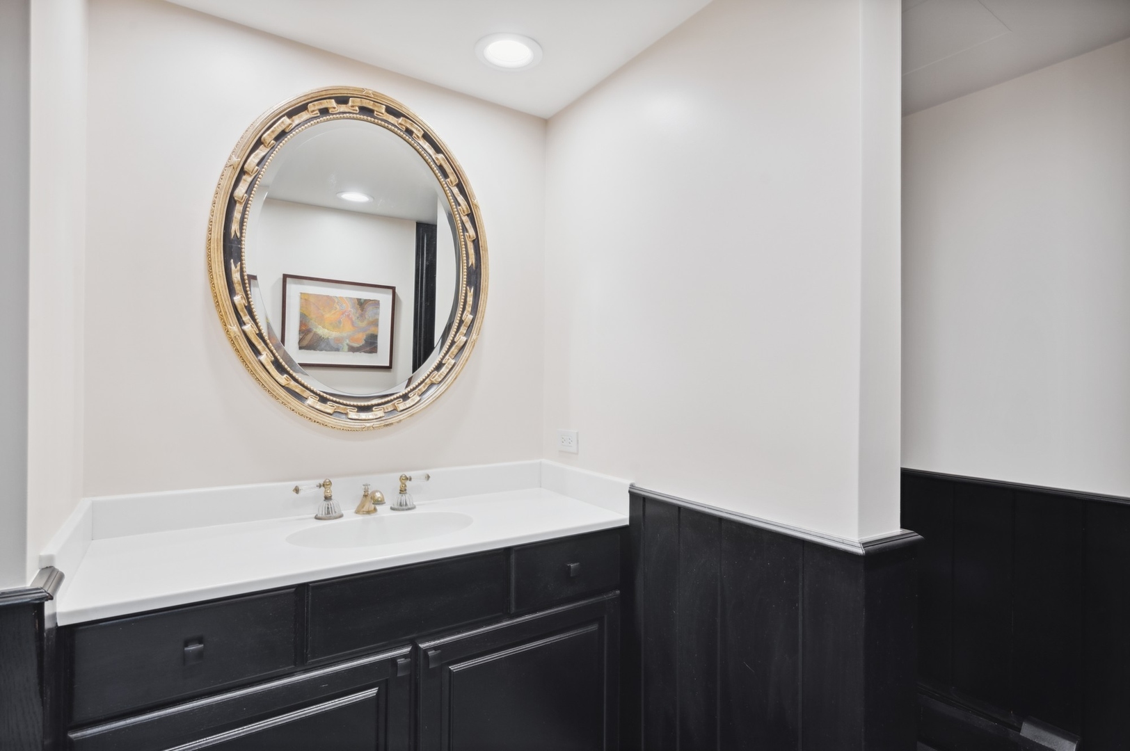 1140 Seneca Road Wilmette, IL 60091 - Photo 51 of 65 a bathroom with a sink and a mirror