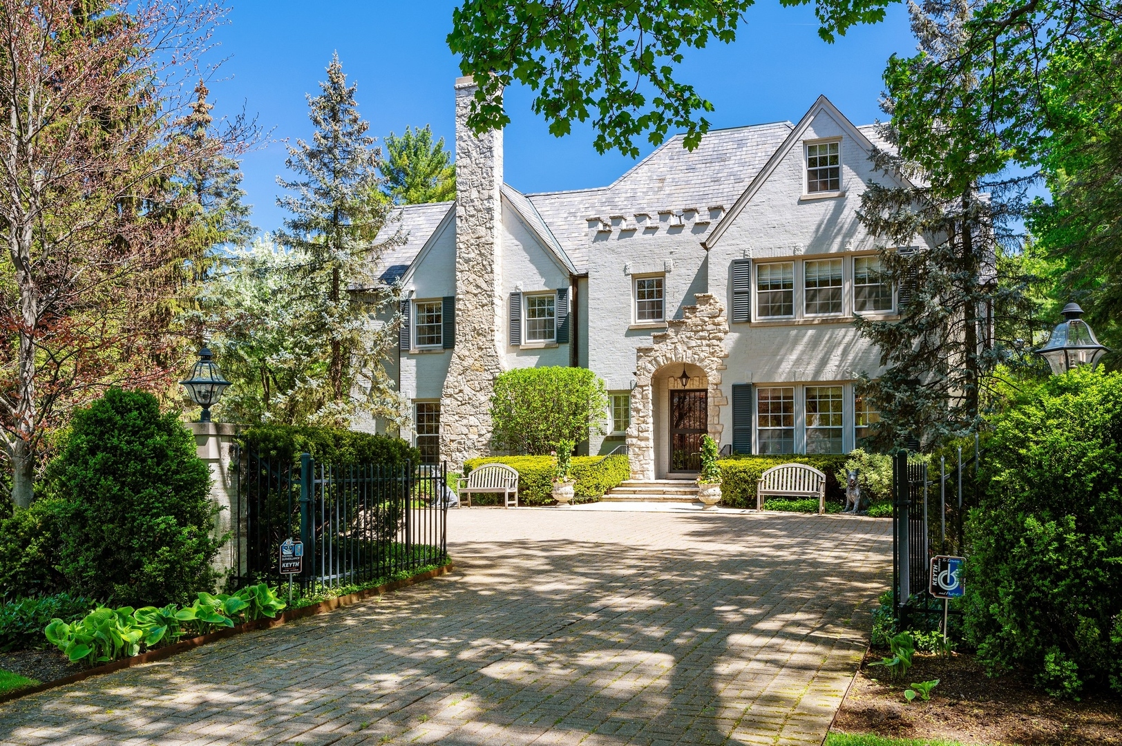 1140 Seneca Road Wilmette, IL 60091 - Photo 60 of 65 a front view of a house with a garden