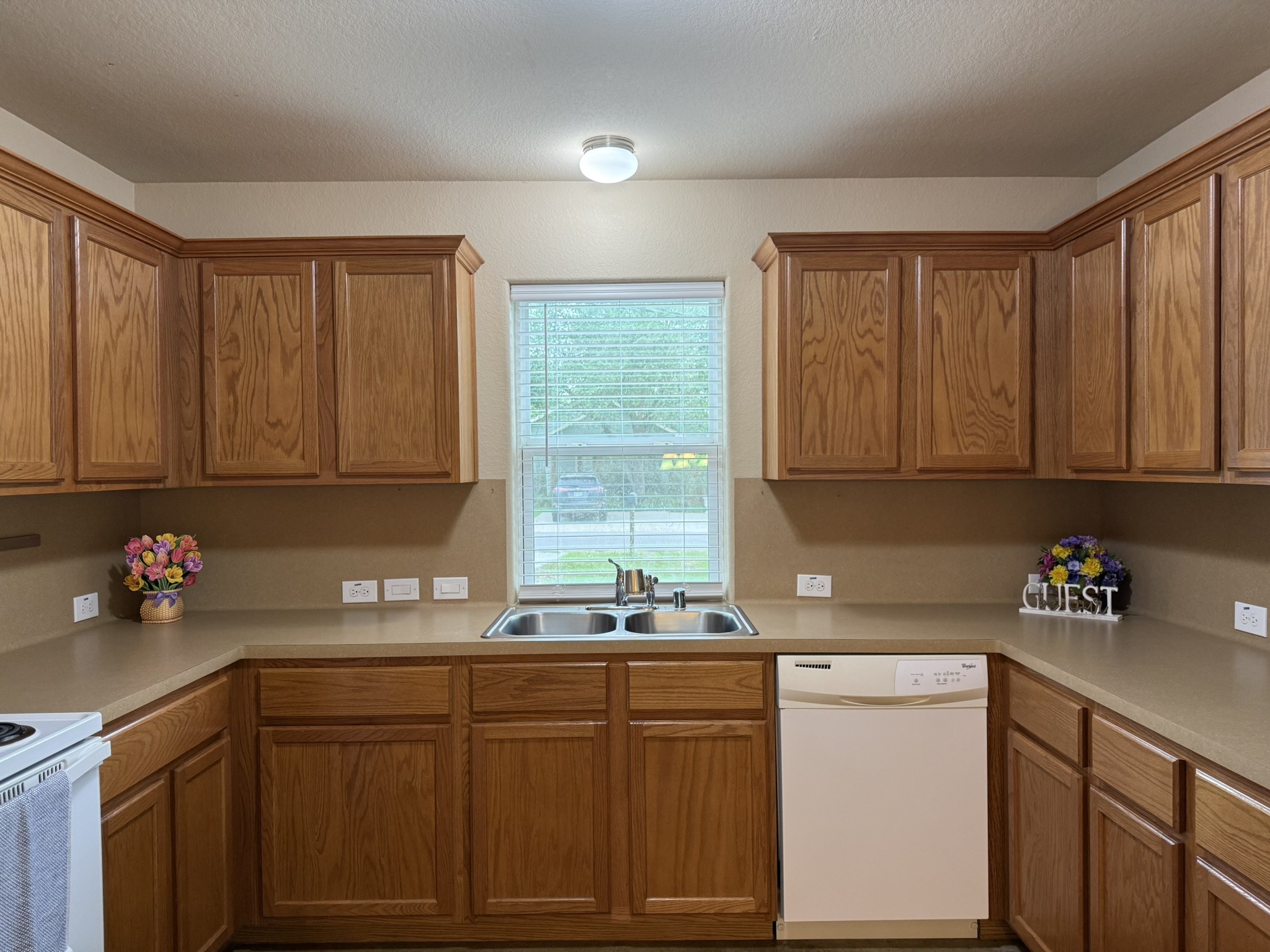 11817 13th Street Santa Fe, TX 77510 - Photo 3 of 23 Spacious kitchen with window that looks out into the front yard.