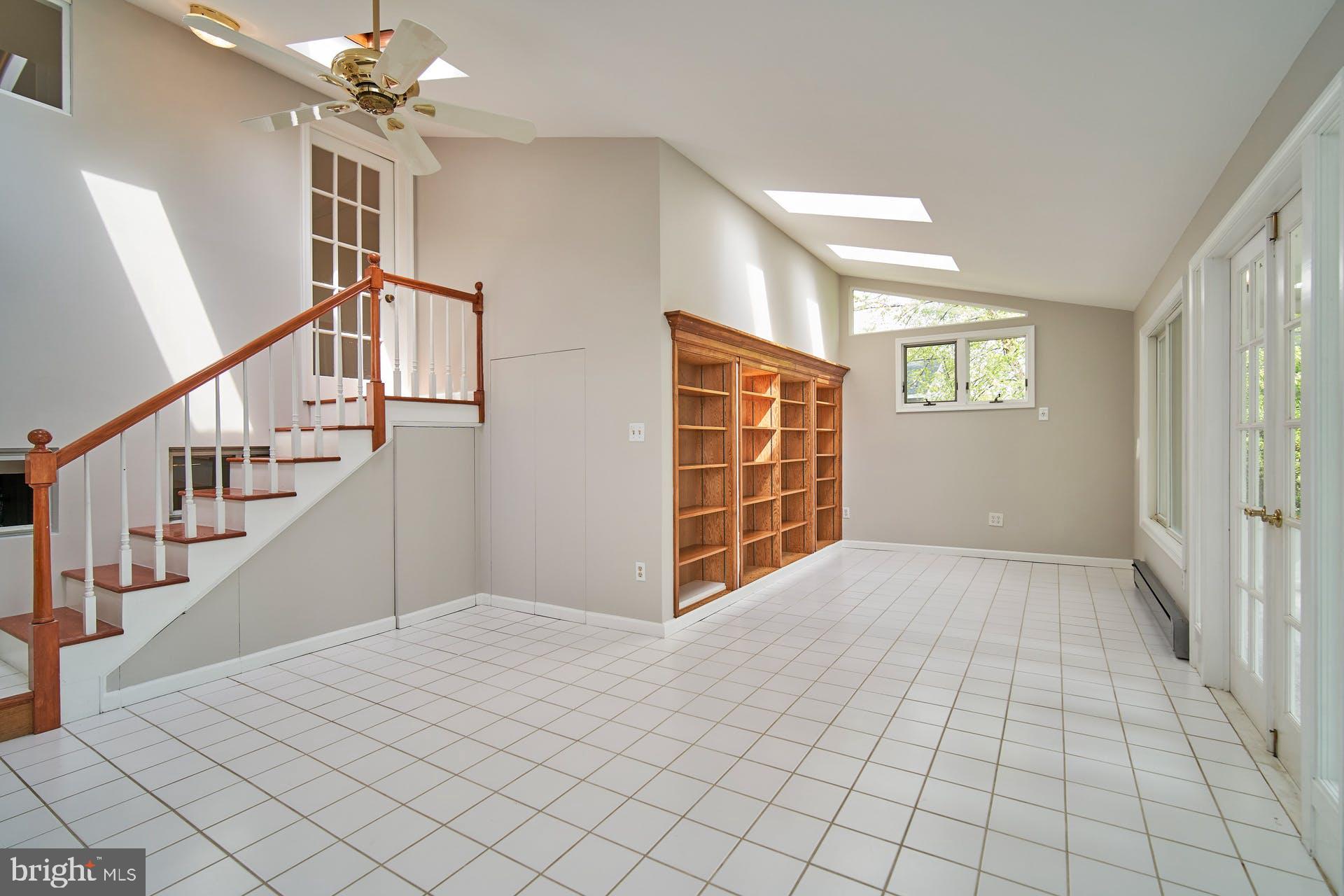 5312 Ferndale Street Springfield, VA 22151 - Photo 14 of 31 Family room with rear staircase to primary bedroom