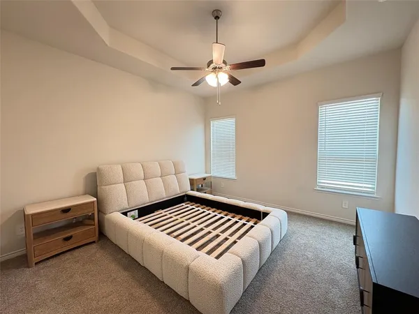 a bedroom with a bed and window