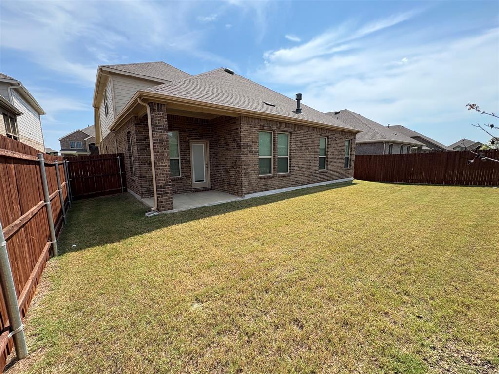 3823 Tack Aubrey, TX 76227 - Photo 18 of 27 a front view of house with yard