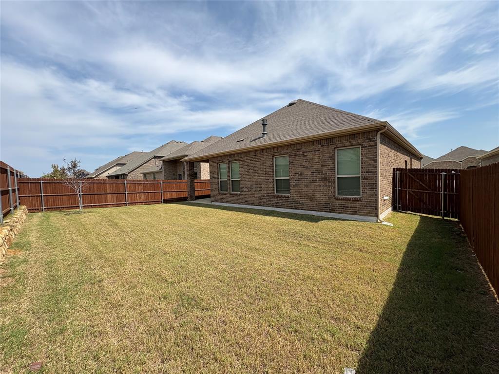3823 Tack Aubrey, TX 76227 - Photo 19 of 27 a view of a house with basketball court