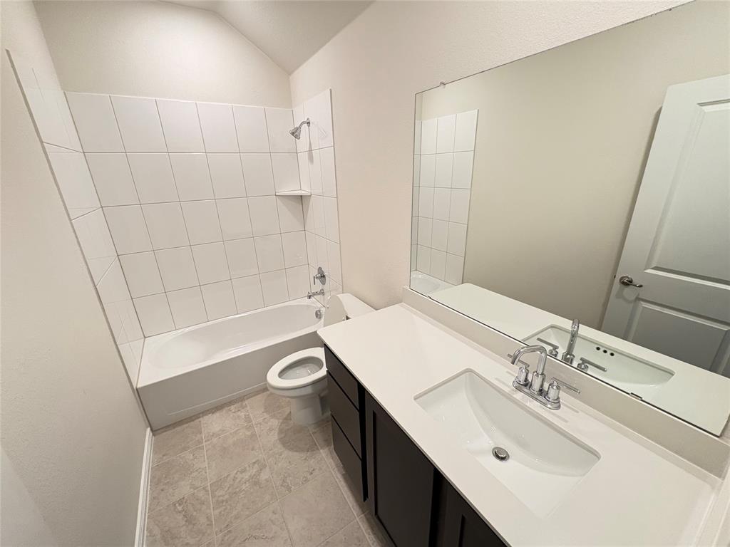 3823 Tack Aubrey, TX 76227 - Photo 5 of 27 a bathroom with a sink a toilet and shower