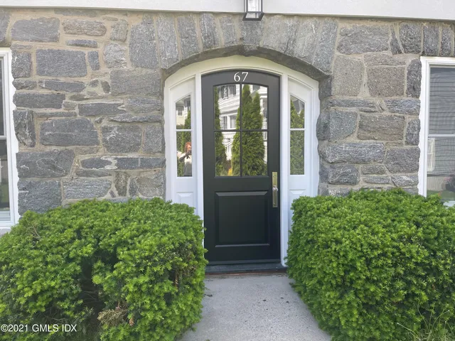 a front view of a house with a glass door