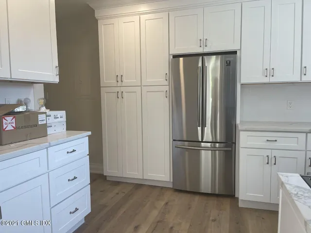 a kitchen with cabinets and stainless steel appliances