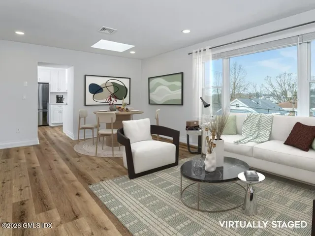 a view of a house with a wooden fence