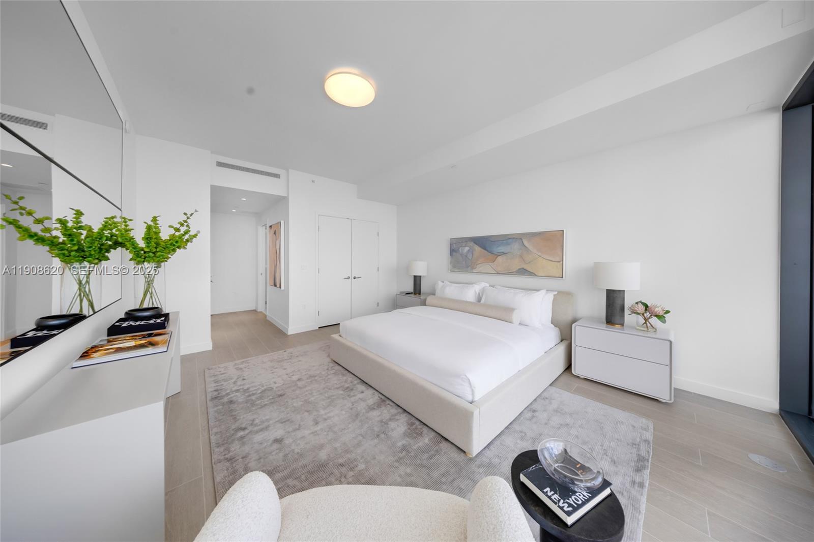 500 Alton Road, Unit 1904 Miami Beach, FL 33139 - Photo 12 of 28 a bedroom with bed and ceiling fan