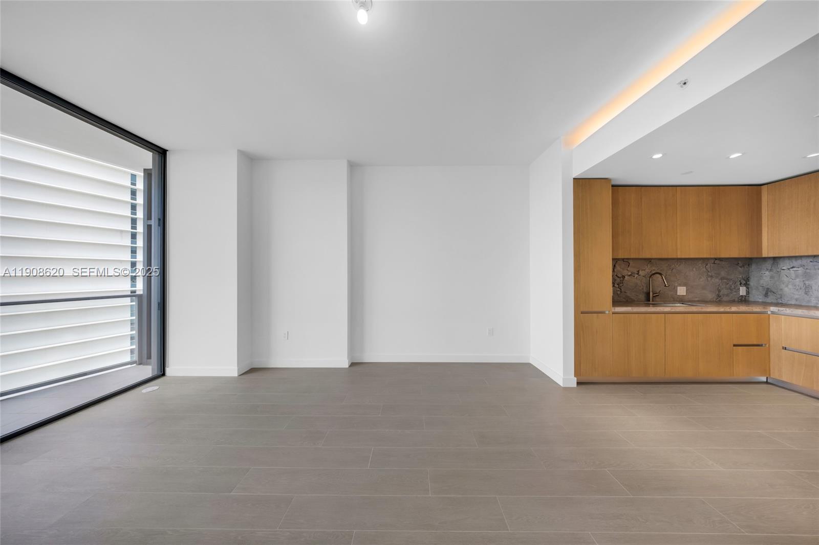 500 Alton Road, Unit 1904 Miami Beach, FL 33139 - Photo 17 of 28 a view of an empty room with a window