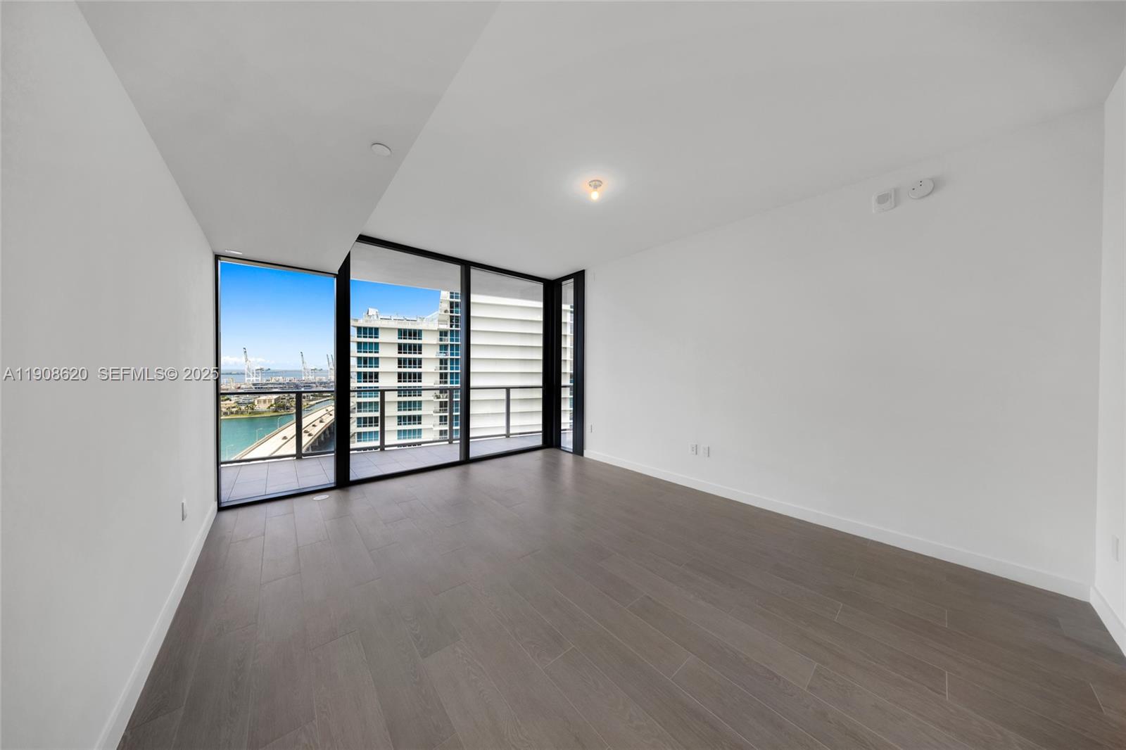 500 Alton Road, Unit 1904 Miami Beach, FL 33139 - Photo 22 of 28 a view of an empty room with a window