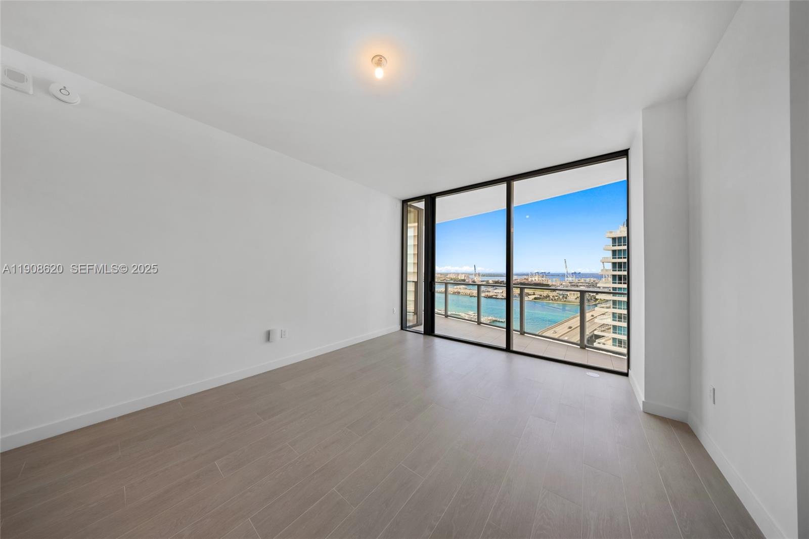 500 Alton Road, Unit 1904 Miami Beach, FL 33139 - Photo 24 of 28 a view of an empty room with a window