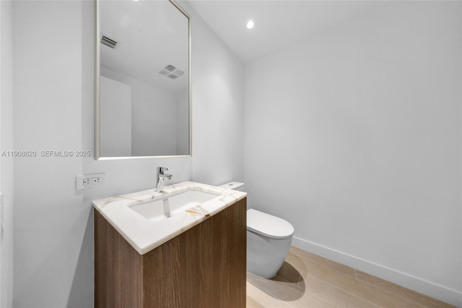 500 Alton Road, Unit 1904 Miami Beach, FL 33139 - Photo 27 of 28 a bathroom with a sink and a toilet