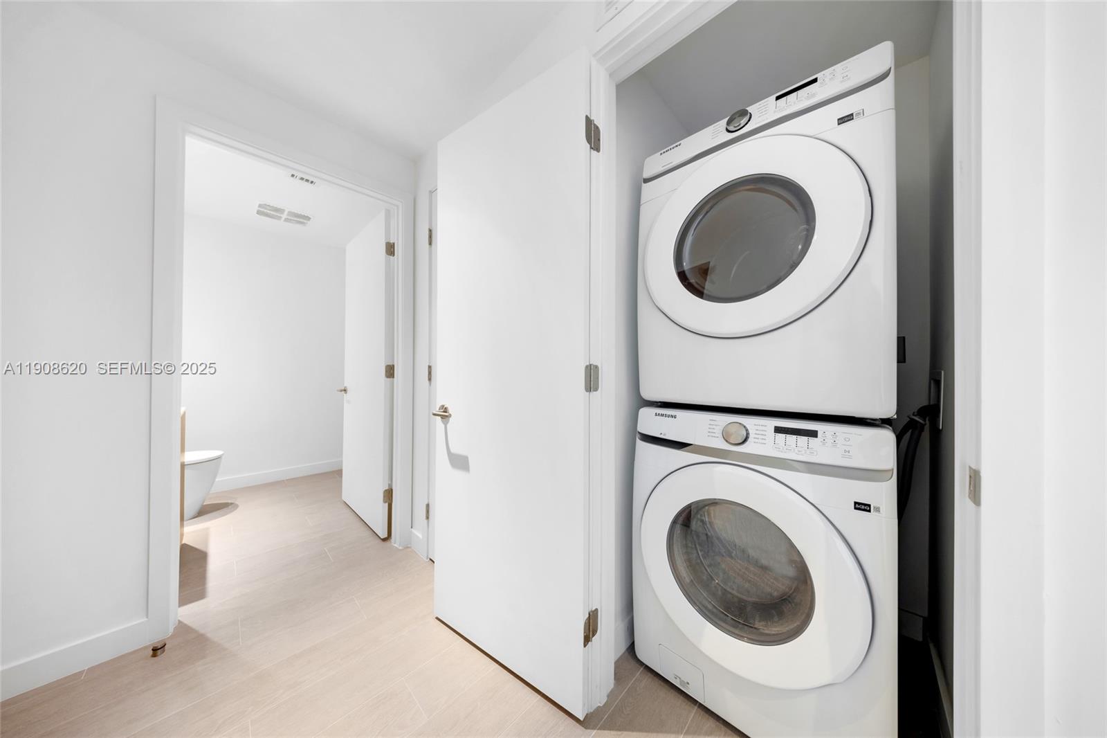 500 Alton Road, Unit 1904 Miami Beach, FL 33139 - Photo 28 of 28 a view of a hallway with washer and dryer