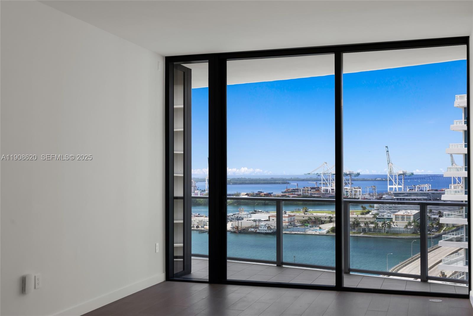 500 Alton Road, Unit 1904 Miami Beach, FL 33139 - Photo 4 of 28 an empty room with a window