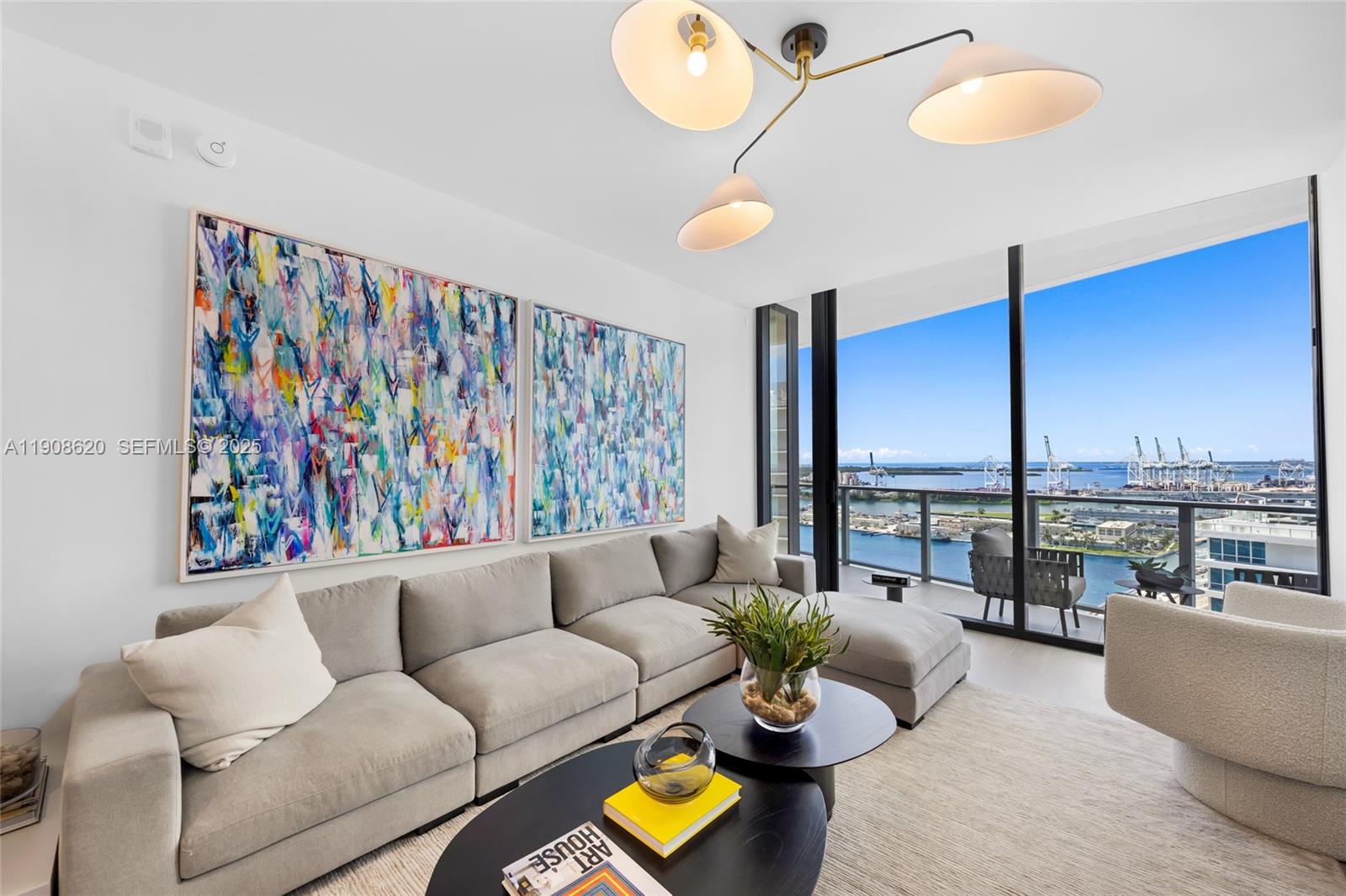 500 Alton Road, Unit 1904 Miami Beach, FL 33139 - Photo 7 of 28 a living room with furniture and a floor to ceiling window