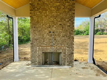 a spacious bathroom with a granite countertop sink a toilet and shower