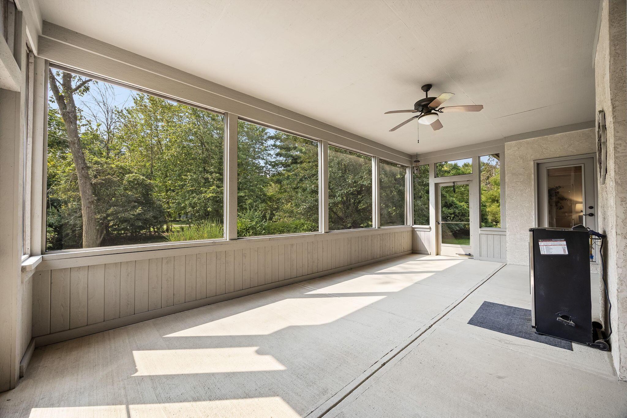 8312 Steitz Road Powell, OH 43065 - Photo 47 of 78 screened in porch with tree view