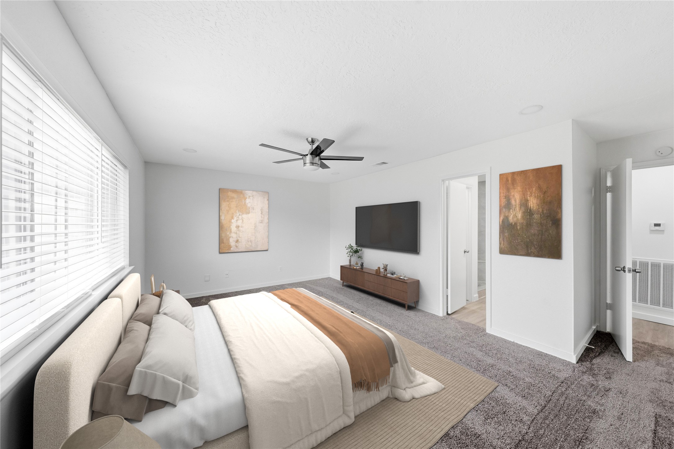 2303 Keyhole Lane Houston, TX 77084 - Photo 12 of 28 a bedroom with a bed and a flat screen tv