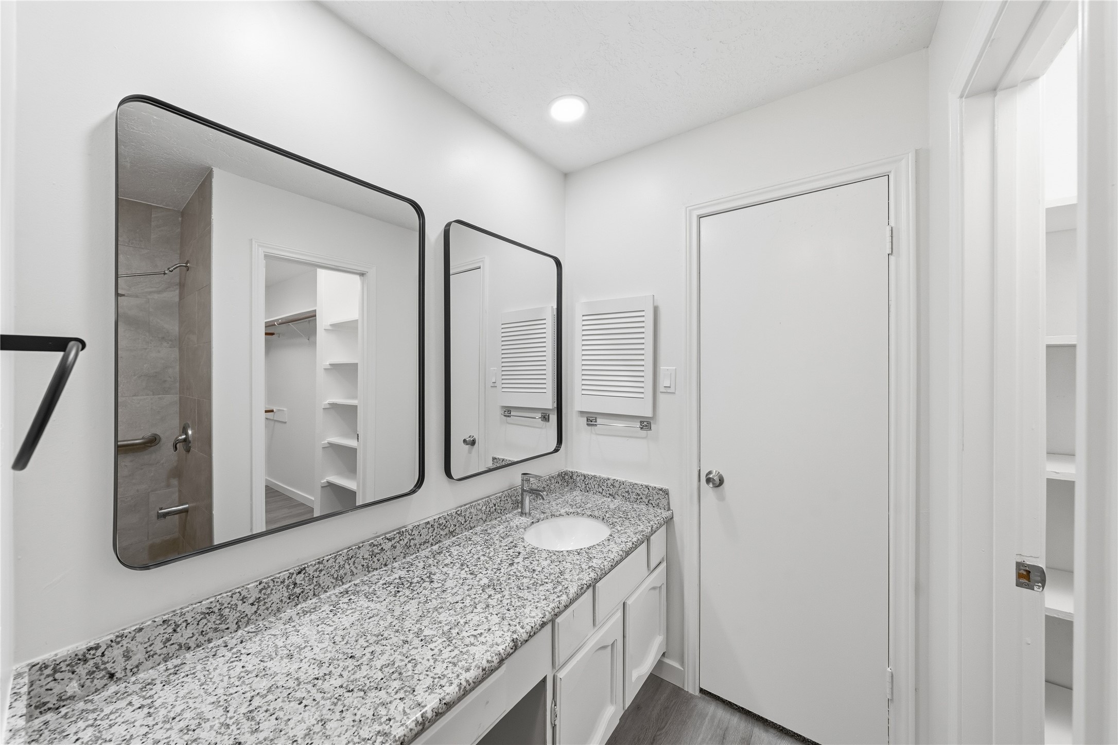 2303 Keyhole Lane Houston, TX 77084 - Photo 15 of 28 a bathroom with a granite countertop sink and a mirror