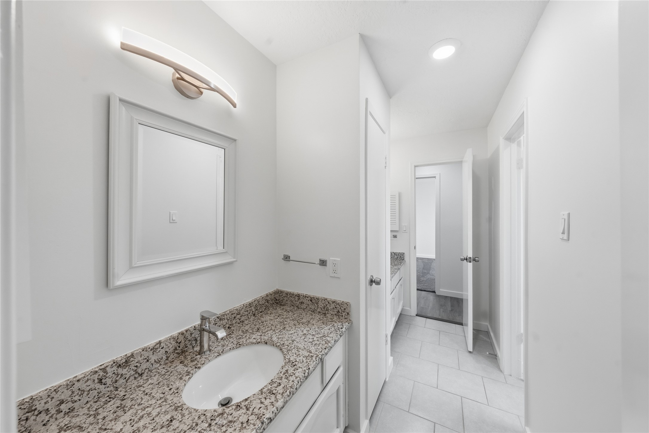 2303 Keyhole Lane Houston, TX 77084 - Photo 27 of 28 a bathroom with a granite countertop sink and mirror