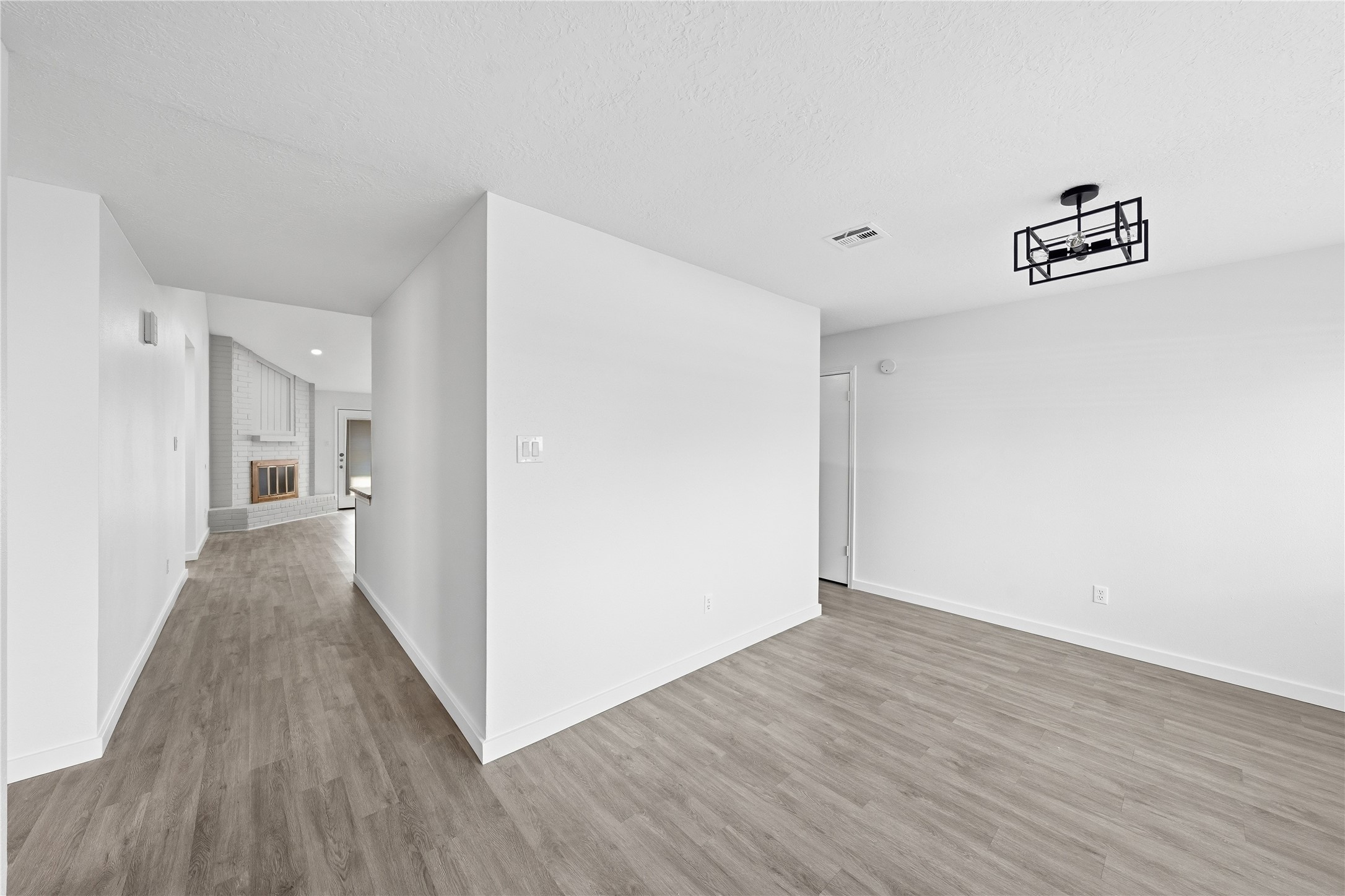 2303 Keyhole Lane Houston, TX 77084 - Photo 4 of 28 a view of a hallway with wooden floor