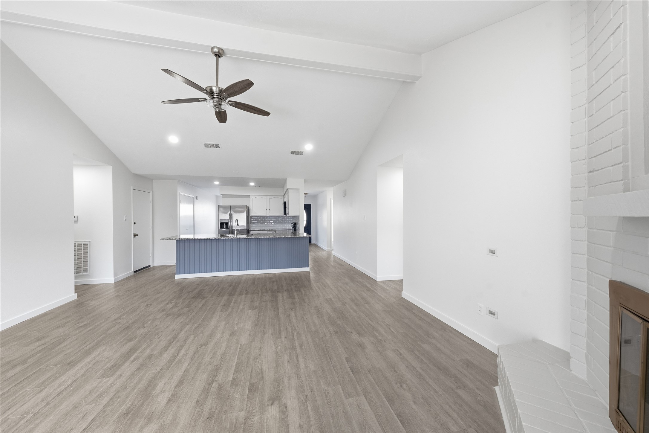 2303 Keyhole Lane Houston, TX 77084 - Photo 6 of 28 a view of a kitchen with a sink and wooden floor