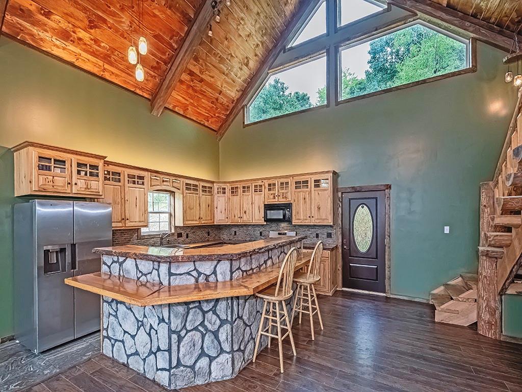 179 Rocks Road Parker, PA 16049 - Photo 11 of 29 a view of kitchen with furniture and wooden floor