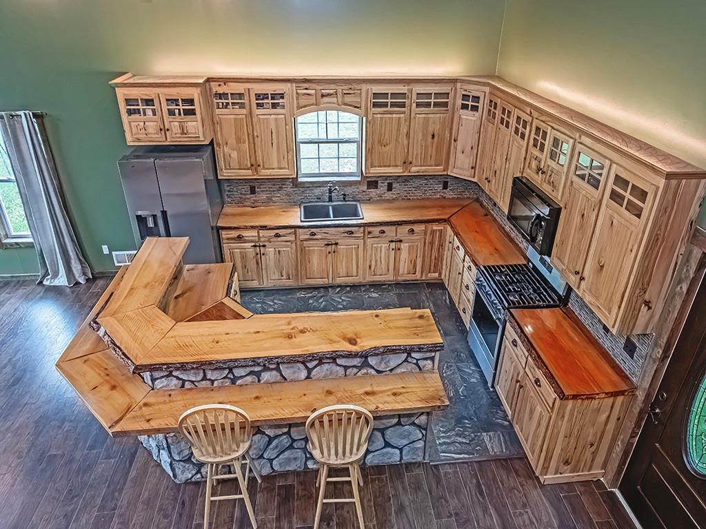 179 Rocks Road Parker, PA 16049 - Photo 13 of 29 a view of balcony with furniture and wooden floor