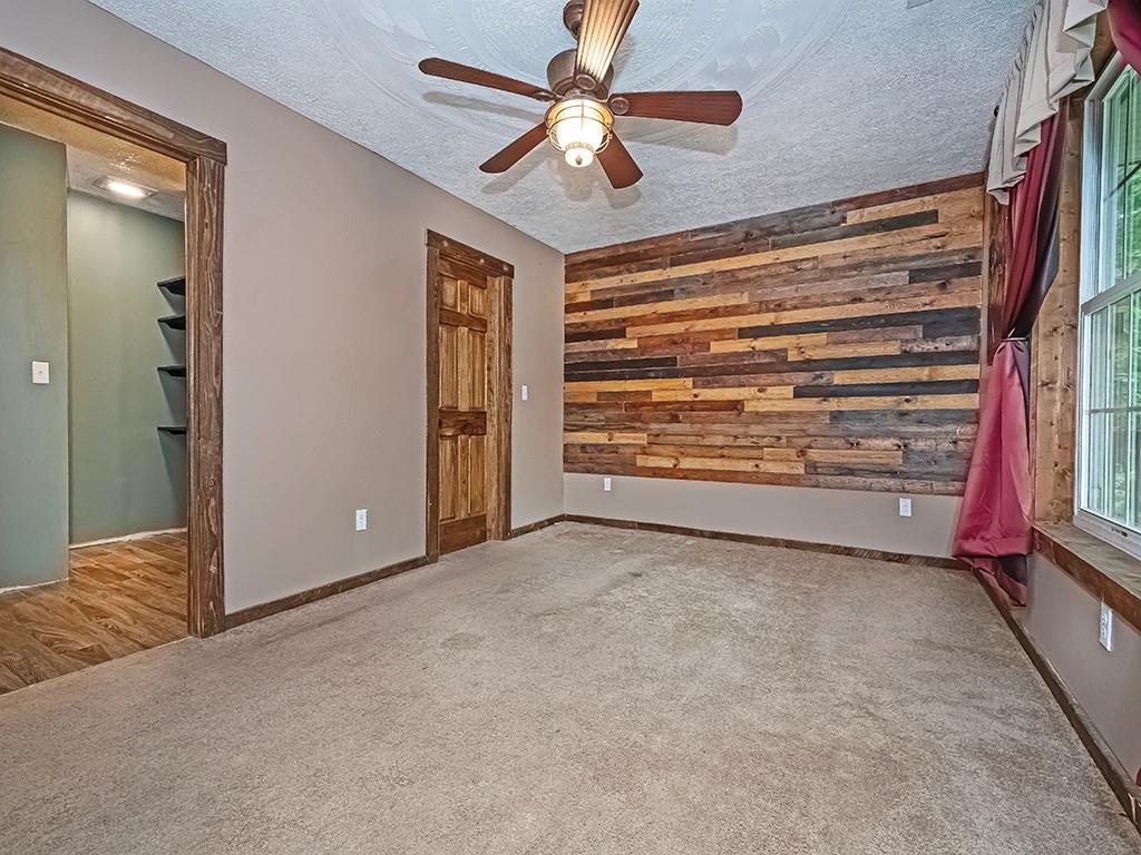179 Rocks Road Parker, PA 16049 - Photo 17 of 29 a view of an empty room with a ceiling fan