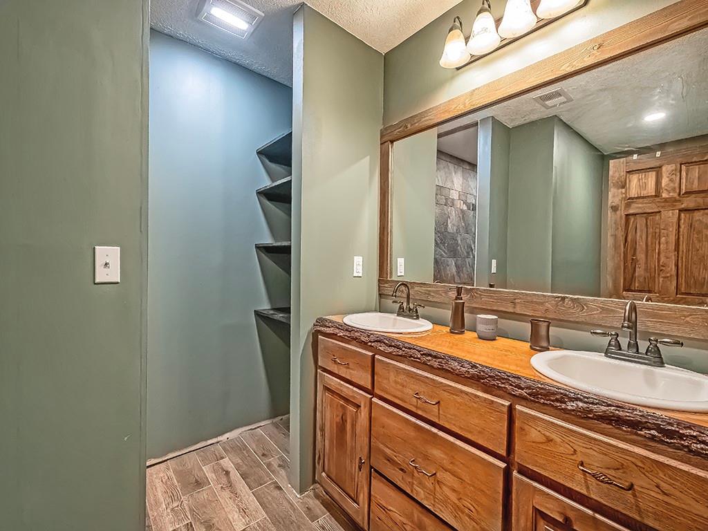 179 Rocks Road Parker, PA 16049 - Photo 19 of 29 a bathroom with a sink and a mirror