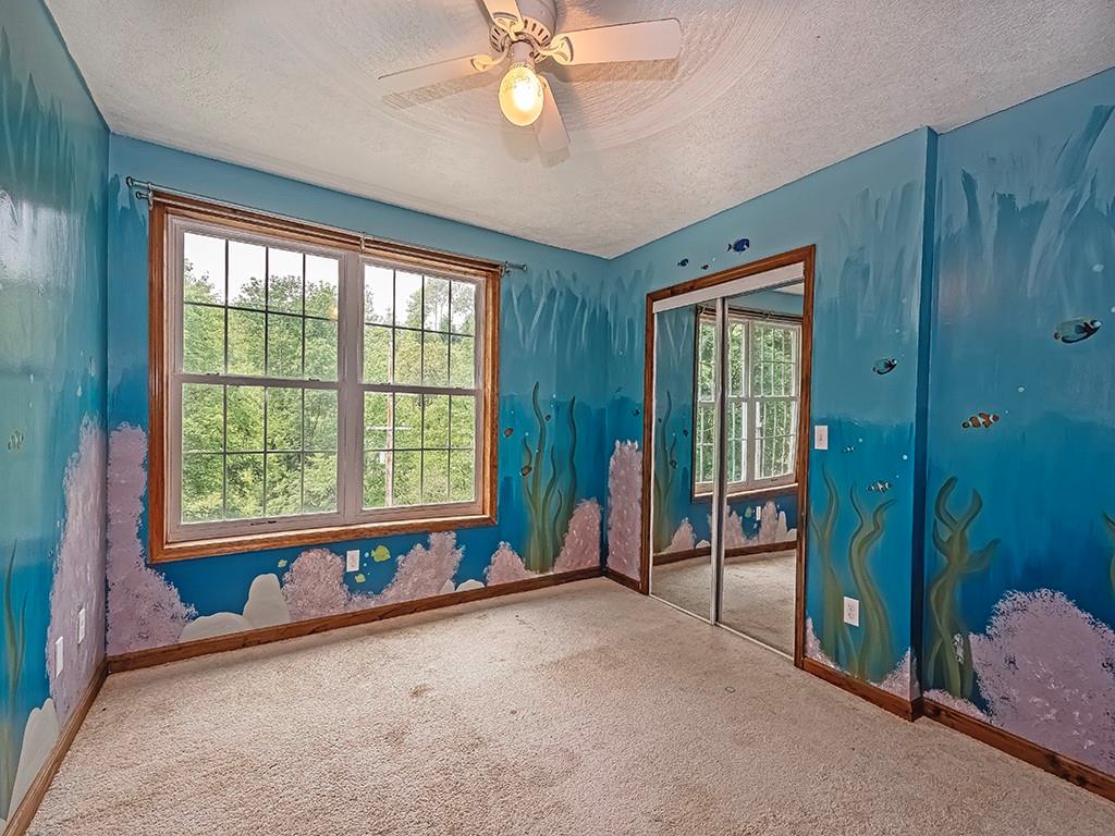 179 Rocks Road Parker, PA 16049 - Photo 20 of 29 a view of livingroom with furniture and windows
