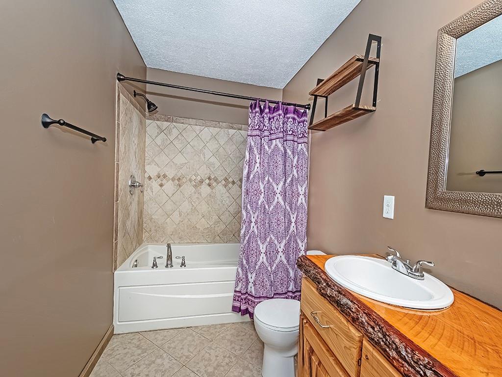179 Rocks Road Parker, PA 16049 - Photo 25 of 29 a bathroom with a sink toilet and shower