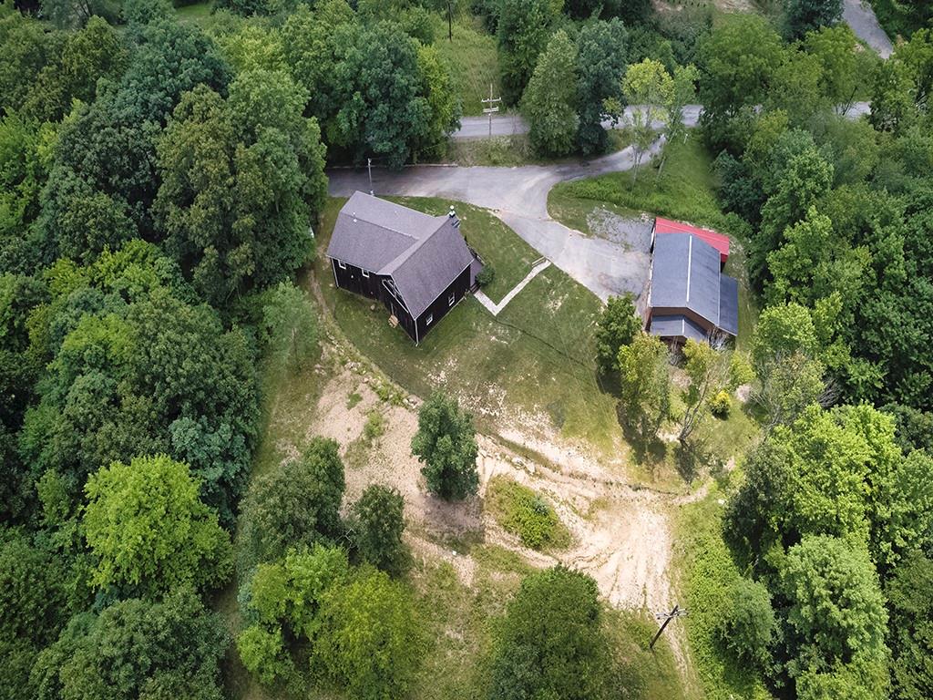 179 Rocks Road Parker, PA 16049 - Photo 4 of 29 an aerial view of a house with swimming pool and red chairs