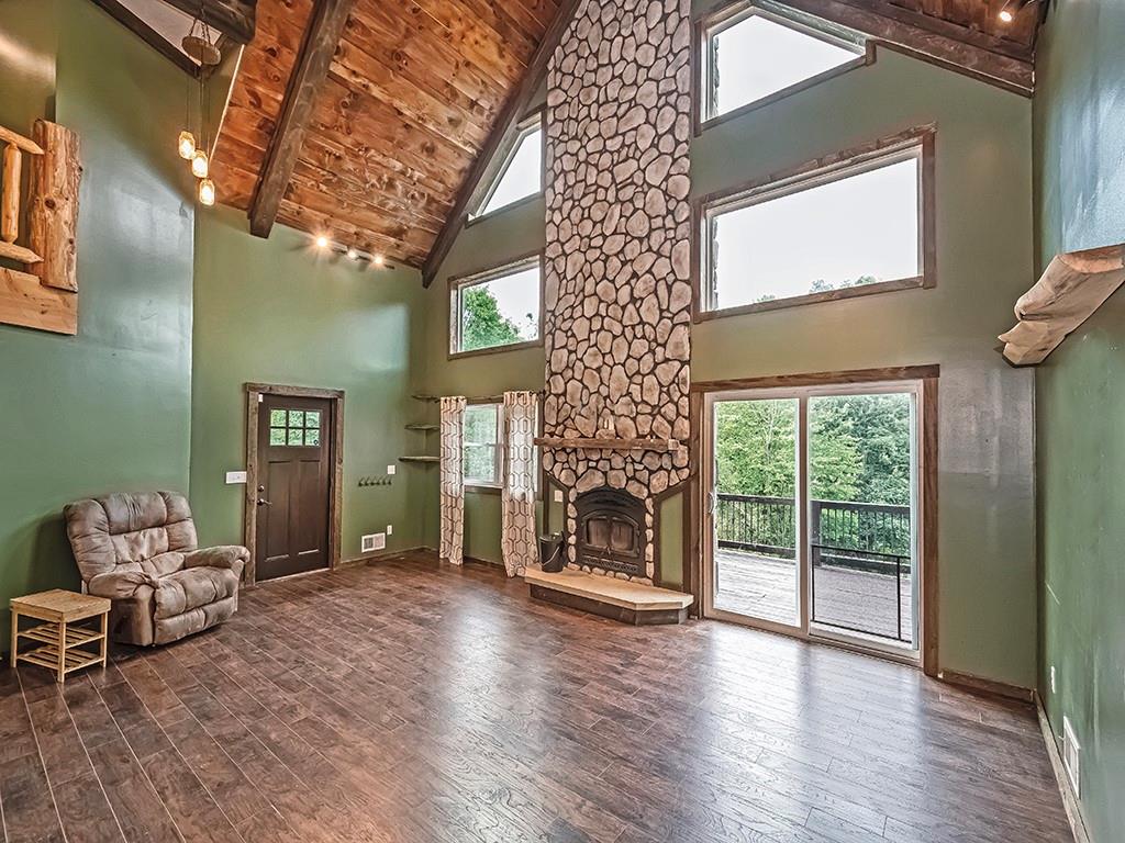179 Rocks Road Parker, PA 16049 - Photo 8 of 29 a living room with furniture and a fireplace